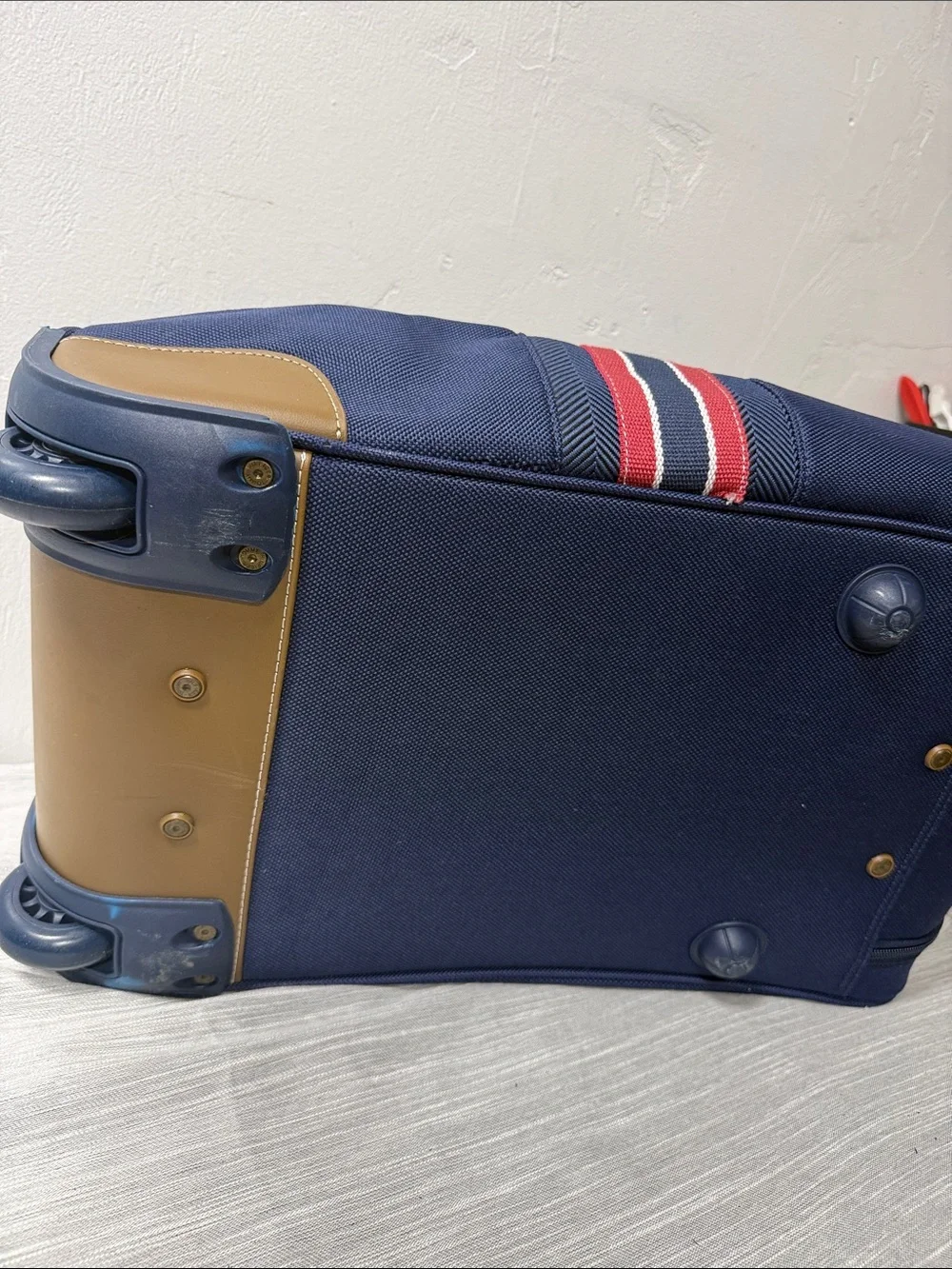 Tommy Hilfiger Navy rolling Duffel with Red & White Center Stripe  carry on